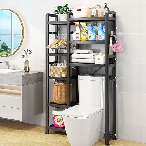 Bathroom storage shelf over toilet with cleaning supplies and towels.