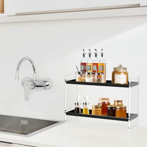 Kitchen counter with spice rack and faucet.