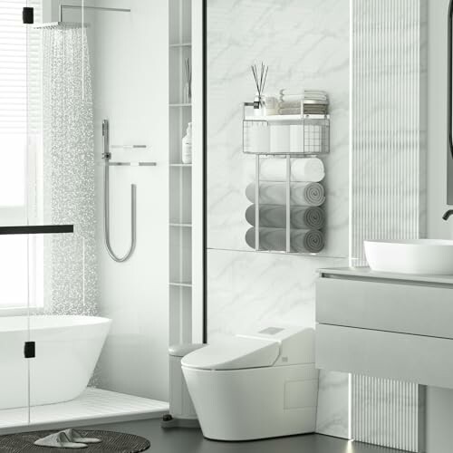 Modern bathroom with shower, bathtub, and toilet.