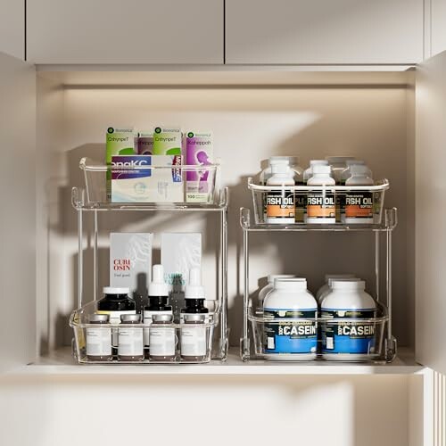 Organized cabinet with supplements and toiletries on clear shelves.