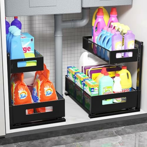 Organized under-sink storage with cleaning supplies and baskets.